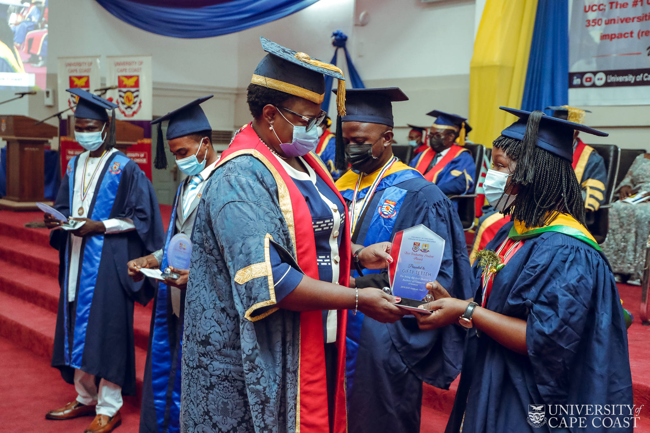 Pro Vice-Chancellor handing over an award