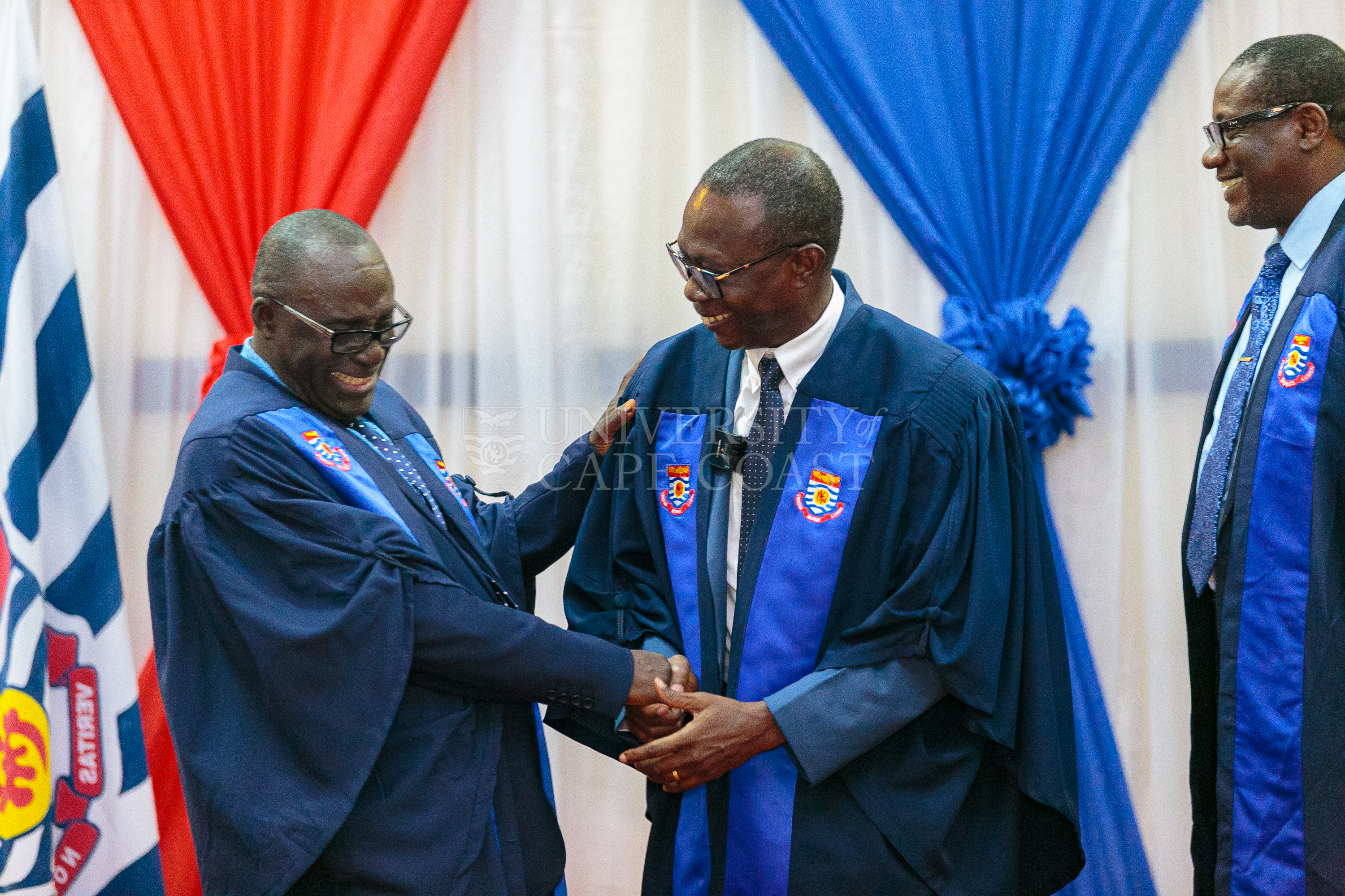 VC-UCC, Prof. Boampong, congratulating Rev. Prof Asare-Danso. Looking on is Prof. Philip Ebow Bondzie- Simpson