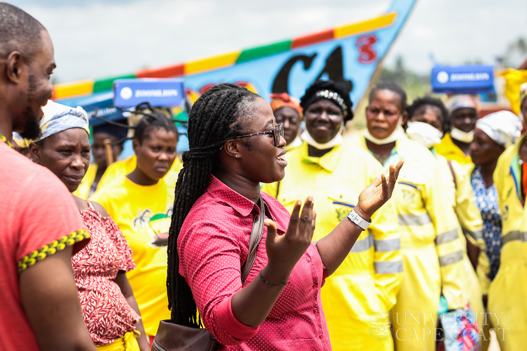 Ms Esinam Attipoe educating participants after the cleaning exercise.