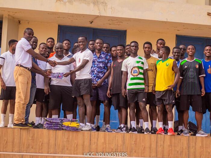 The SRC President presenting the t-shirts to coaches of the team The SRC President presenting the t-shirts to coaches of the team