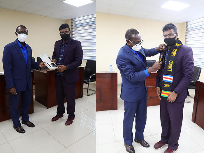 Vice-Chancellor, Prof. Johnson Nyarko Boampong and Dr. Shiv Shankar Shah exchanging gifts. 